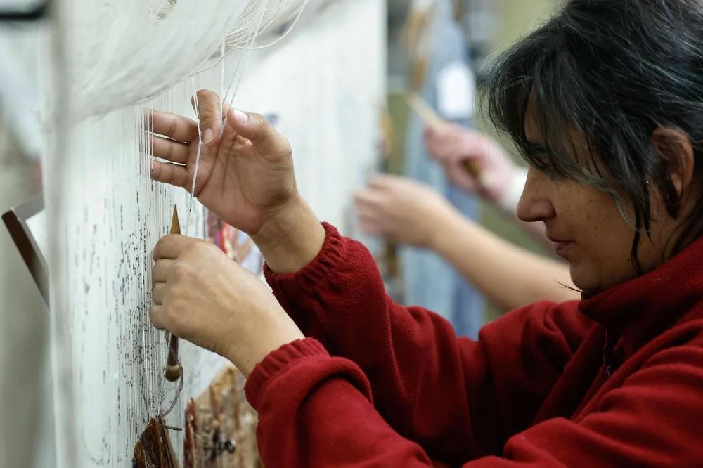 The Art of Restoration: Hands That Weave and Repair Centenary Carpets in Huelva